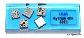 image of an IBM paperweight wirh system 360 computer SLT logic chips from 1964