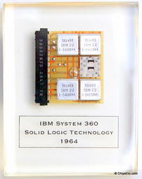 image of an IBM paperweight wirh a system 360 computer SLT processor module