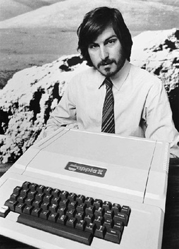 image of Steve Jobs with his Apple II Computer in 1977