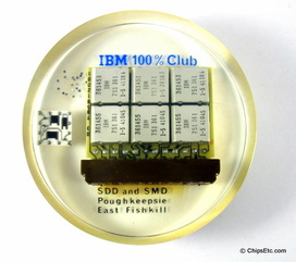 image of an IBM paperweight wirh a system 360 computer SLT processor module
