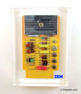 image of an IBM paperweight with a standard modular system SMS transitorized computer circuit board 