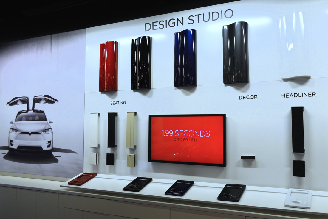 Tesla showroom design studio paint upholstery colors 